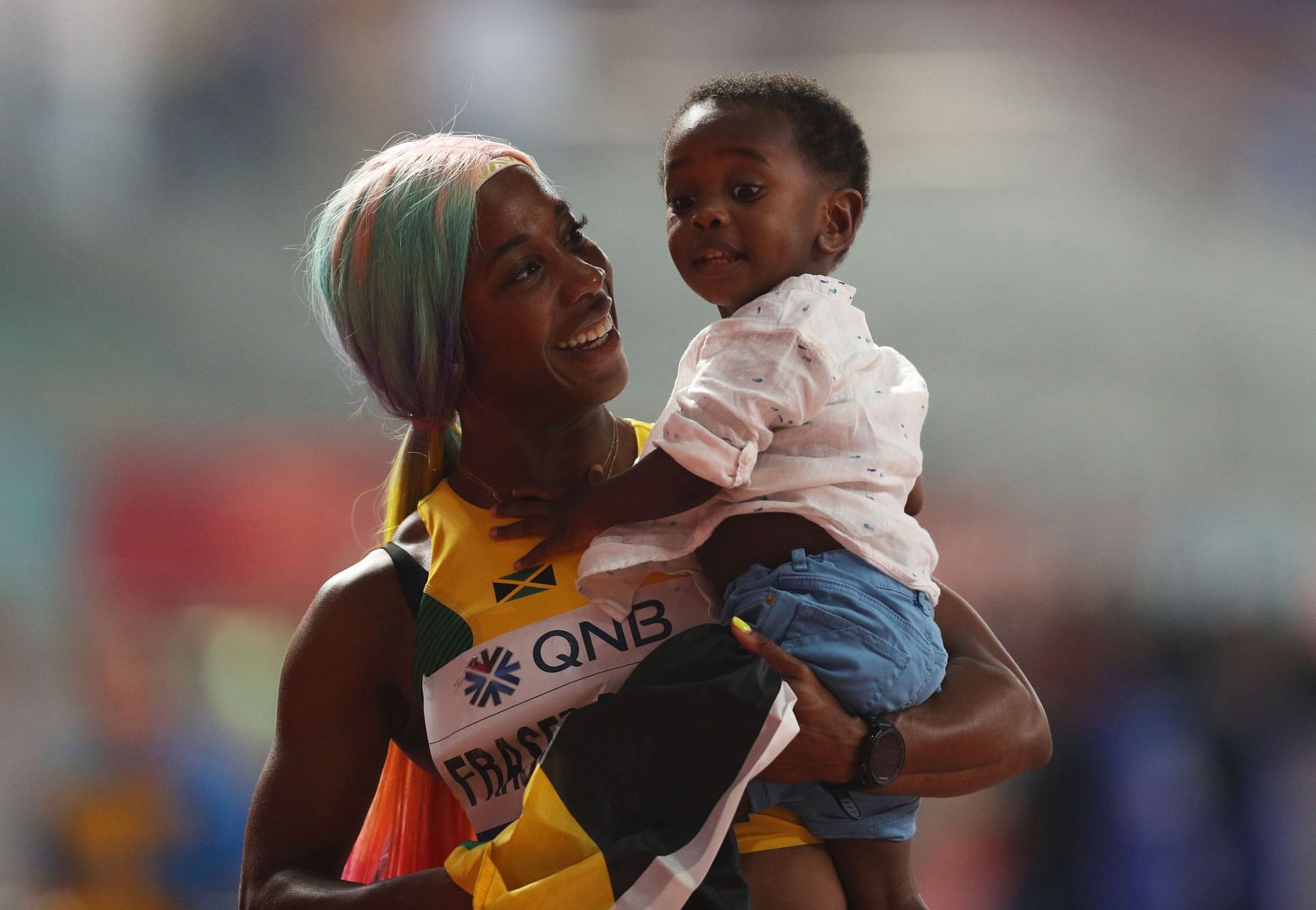 Fraser-Pryce and her son at the 17th IAAF World Athletics Championships Doha 2019 - Day Three - (Source: Getty)